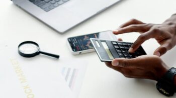 photo of person using calculator