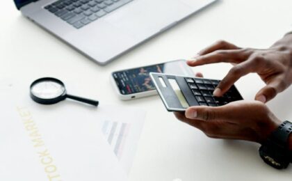 photo of person using calculator